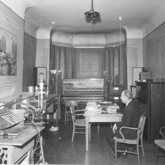 Professor Myron Schaeffer in the first electronic music studio in a house on Division St on U of T St. George campus, 1959